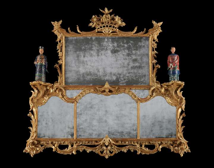 A carved giltwood overmantel mirror